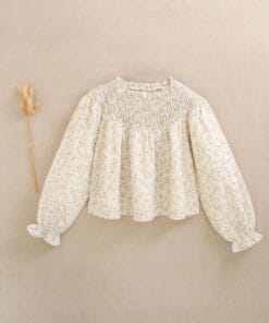 blusa de niña color crudo con estampado floral